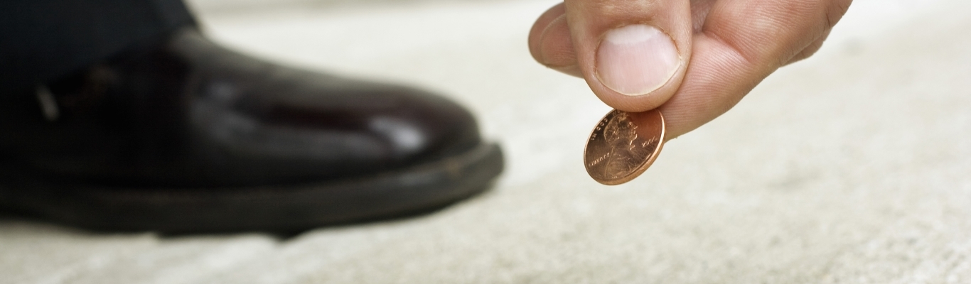 Man Picking Penny Up Off Ground